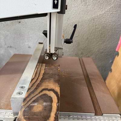 A wooden log on a band saw